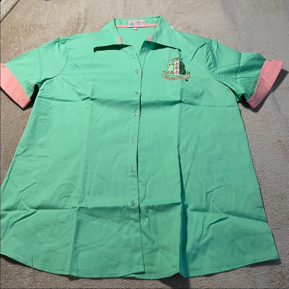 Alpha Kappa Alpha Crest Woven Apple Green shirt.